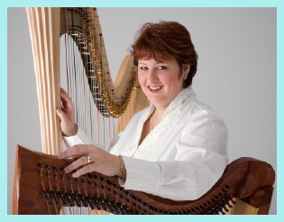 Amy with two styles of harp